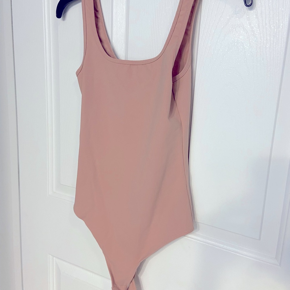 Peach colored bodysuit
